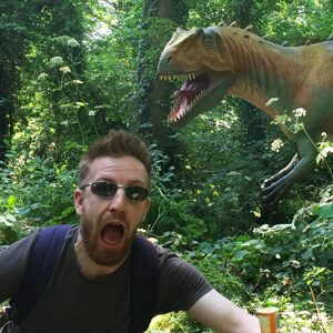 Stupid photo of me, Mike Laraman, running away from an Allosaurus while holding a Calippo